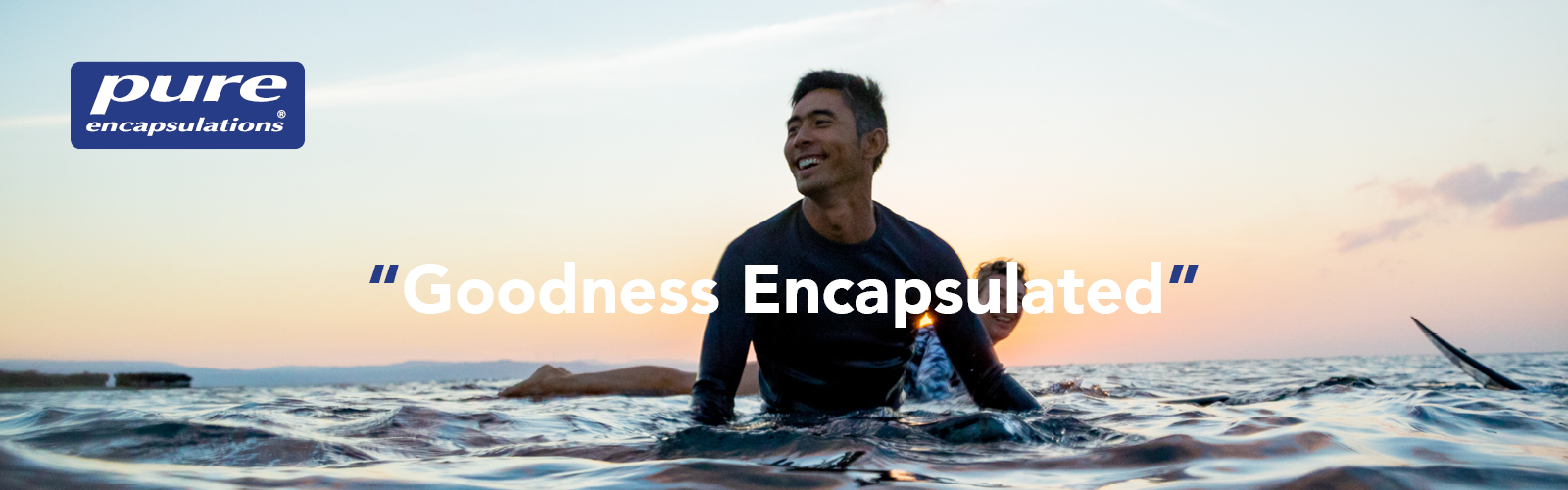 A man surfing in the ocean with a Pure Encapsulation Logo and “Goodness encapsulated” written on the image.
